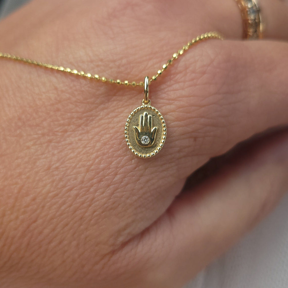 Dalia T Online Necklace 14KT Small Hamsa medallion necklace with a diamond